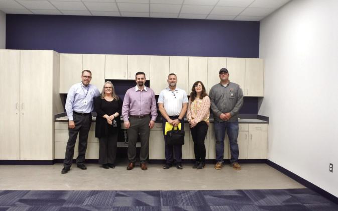 Superintendent Dr. Matt Posey, Principal Tammy Cook, Brandon Bussell, David Elmore, Susan Watson, and P.J. Gibson pose in one of the finished classroom at the end of the tour of the new Upper Elementary. Countywide &amp;amp; Sun/Suzie Campbell