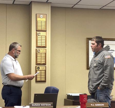Bethel School Board President David Elmore swears in returning member P.J. Gibson during the meeting held Monday, April 10, 2023.