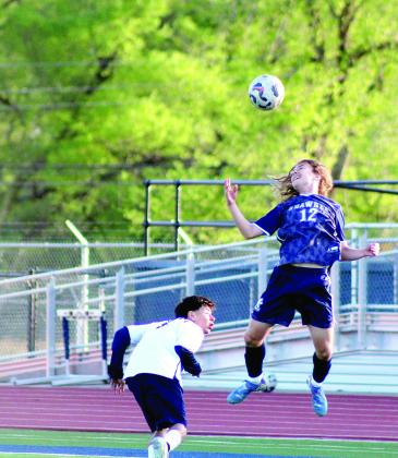 Shawnee sophomore Jax Martin keeps the ball in play with a header during the Apr. 8 home game with Nathan Hale. The Wolves won, 2-0. Natasha Dunagan, Countywide &amp; Sun