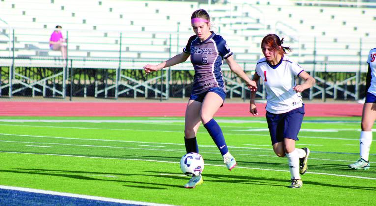 Shawnee freshman Gemma LaPlant gets the ball to the goal, but her shot is stopped by the goalie. Natasha Dunagan, Countywide &amp; Sun