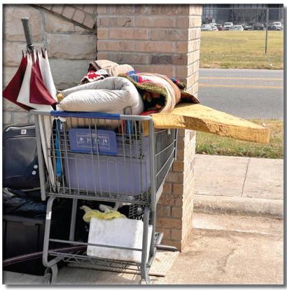 This shopping cart holds all the possessions of someone living on the streets in Shawnee. Countywide &amp;amp; Sun/Suzie Campbell