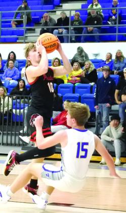Dale’s Dallen Forsythe goes up for the shot as Bethel’s Gavin Lynch takes the hit. Dale won 81-37. Countywide &amp; Sun/ Suzie Campbell