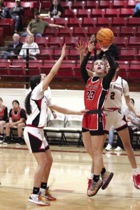 Earlsboro sophomore Xalina McCarroll aims for the bucket and sinks it during the fourth quarter of the Class B Regionals against Geary on Feb. 15. The Lady Wildcats won that game, 52-38, and lost their second regional game, with Sasakwa, 37-60. Countywide &amp;amp; Sun/Natasha Dunagan