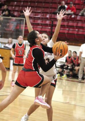Earlsboro freshman Mia Tanyan pushes past the Geary defense during the third quarter of the Class B Regionals on Feb. 15.