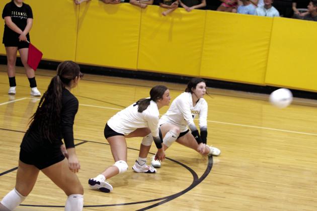 Tecumseh's Kayley Wood and Kaitlyn Elrod are both ready to make the hit during the match with Bethany on Aug. 20. Countywide &amp; Sun/Natasha Dunagan
