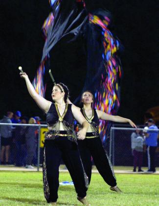 Tecumseh Flag Corp members Brooke Bircher and Makenzie Brown perform to songs from “Aladdin” during halftime of the home football game on Oct. 7. Countywide &amp;amp; Sun/Natasha Dunagan