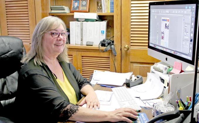 Suzie Campbell, owner and publisher of the “Countywide &amp;amp; Sun,” sits at her desk. April 1 marks the five-year anniversary of when Campbell bought the newspaper, and she has worked at the Countywide for 17 years. Countywide &amp;amp; Sun/Natasha Dunagan