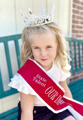 Autumn Hughes, 5, of Tecumseh, poses in her Oklahoma Tiny State Talent sash and crown on June 27. Hughes is planning to compete in the national competition, July 13-17. Countywide &amp; Sun/Julie Talton