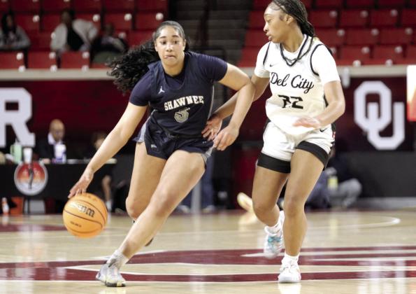 Shawnee junior Chrishelle Milum takes the ball to her teammates during the Class 5A State Quarterfinal game against Del City.