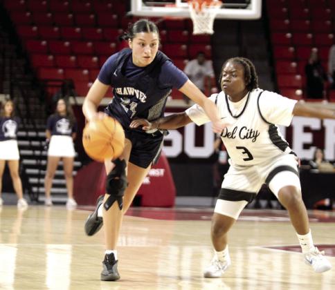 Shawnee senior Daley Rice guards the ball on her way up court during the Class 5A State Quarterfinal.