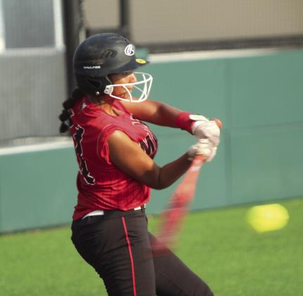 Macomb senior McKenzie Brummett slams a single during the Little River Conference Tournament game against Earlsboro on Sept. 4. Natasha Dunagan, Countywide &amp;amp; Sun