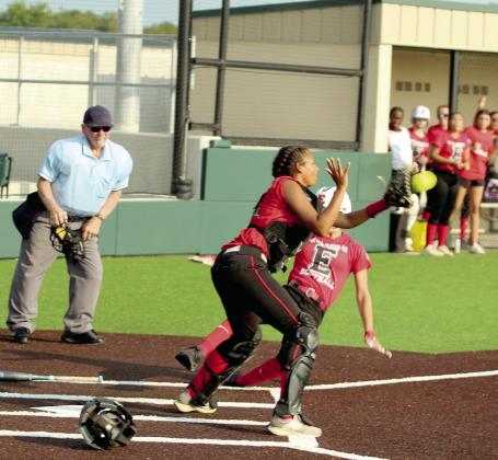 Earlsboro sophomore Lilly Gentry slides into home as Macomb senior McKenzie Brummett makes the catch during the Little River Conference Tournament game on Sept. 4. Natasha Dunagan, Countywide &amp;amp; Sun