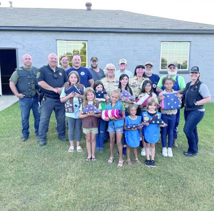 Members of the American Legion, Post 244 and the Cub Scout Troop 477, both in McLoud. The two organizations held a Flag Retirement Ceremony. A member of the American Legion said there were so many flags received that it was impossible to retire all of them in one evening. We will watch for another ceremony to be held in the near future. Photos provided by Monica Poindexter