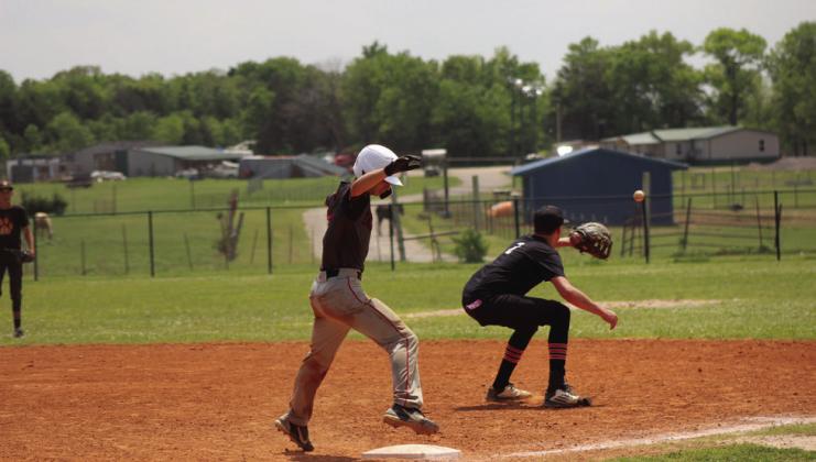 Earlsboro sophomore Brayden Rawls steps on first base before Maud junior Bowdee Brooks makes the catch.