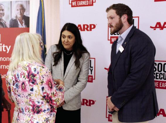 U.S. Representative Stephanie Bice and her aide Marlon Banner listen to Arthenia Haney at the Tecumseh Golden Age Center on Aug. 12 during the AARP Oklahoma celebration of Social Security's 90th anniversary.