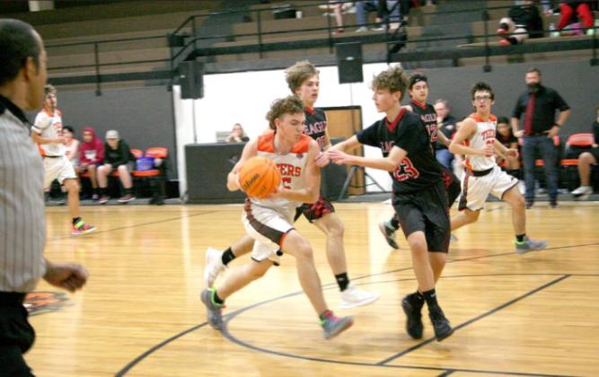Wanette Tigers’ Zane Hulce (#15), evades the Eagles defenses during Wanette’s Friday night win over Victory Life Academy. The Tigers won 60-33. Countywide &amp;amp; Sun/Kendra Johnson