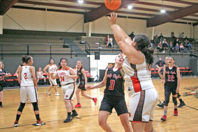 Wanette Lady Tiger senior Cylie Chacon, #3, lines up a scoring shot near the 3-point line during Wanette’s Friday night 30-38 loss to Victory Life Academy.