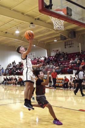 Earlsboro’s Brayden Rawls lays up to increase the lead by 10 against Strother during the homecoming game Dec. 13. Earlsboro won the matchup 63-48.
