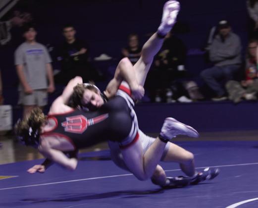 Natasha Dunagan, Countywide &amp;amp; Sun Bethel's Eli Owens takes down Prague's Samuel Tape in the 144 weight class during the dual at Bethel on Dec. 18. Despite this move, Owens lost this match, and overall, Prague's Red Devils beat Bethel's Wildcats 21-39.