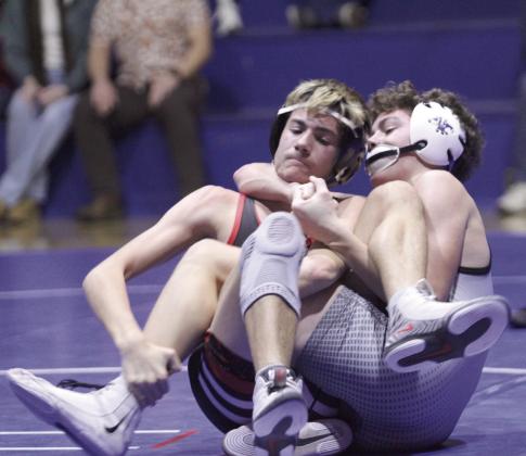 Natasha Dunagan, Countywide &amp;amp; Sun Bethel's Olen Steward, right, and Prague's Kace Smith end up in a pretzel at one point in their match during the dual at Bethel on Dec. 18. Smith won this match by decision.