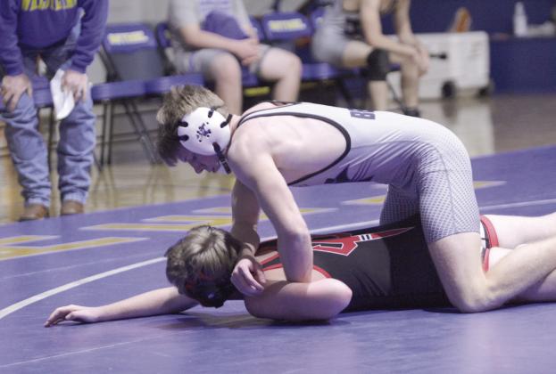 Natasha Dunagan, Countywide &amp;amp; Sun Bethel's Zac Griffith wears down his Prague opponent in the home dual on Dec. 18. Griffith won the match with a pin.