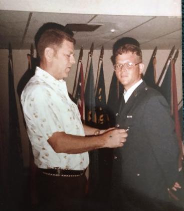 J.D. Sanders’ father, John Kenneth "Kenny" Sanders, pins his Security Police Shield onto his uniform upon graduation from the Air Force Security Police Academy in 1983. Photo provided.
