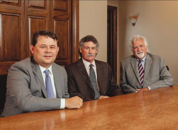 Pictured from left are J. Shawn Spencer, attorney; Bradley C. West, managing partner; and Terry W. West, founder. Photo provided