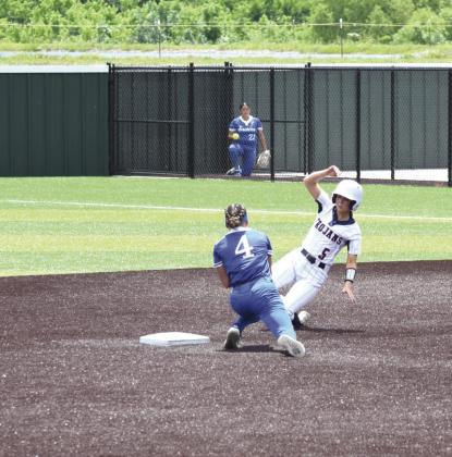 Seminole's Camryn Westbrook slides into second base but not before Eastern's Jaxie Glasson tags her out. Julie Talton, Countywide &amp; Sun