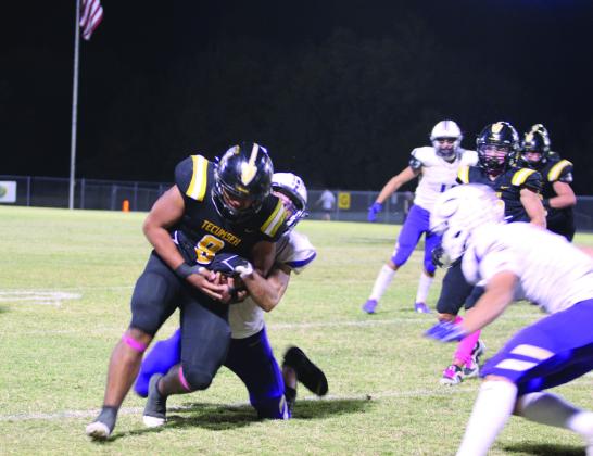 Tecumseh senior Kadyn Prado tries to break free from a tackle during the district home game with Chickasha on Oct. 25. The Savages lost in overtime, 41-47. Countywide &amp; Sun/Natasha Dunagan