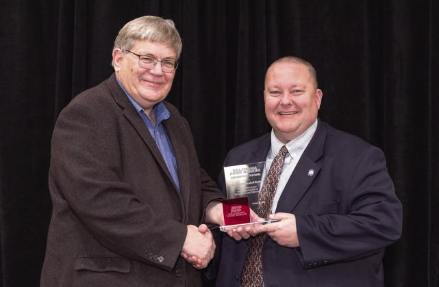 Oklahoma Farm Bureau President Rodd Moesel presents Rep. Dell Kerbs with an Oklahoma Farm Bureau Champion Award at the 2023 OKFB Leadership Conference Feb. 21. Photo provided