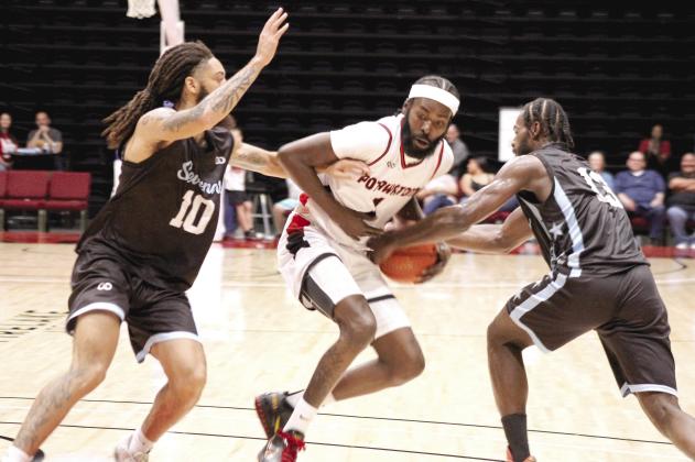 Potawatomi Fire shooting guard Myron McGowan fights to keep control of the ball during the game with the Texas Seveners.