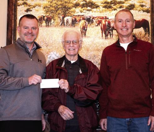 Dale Public Schools Superintendent Will Jones accepts a $6,500 check from Pottawatomie County Facilities Authority Chairman of the Trust Leonard Taron and Vice-Chairman Tom Wilsie on Dec. 14. Dale plans to use the funds for a new phone system. Photo provided by Matt Stephens.
