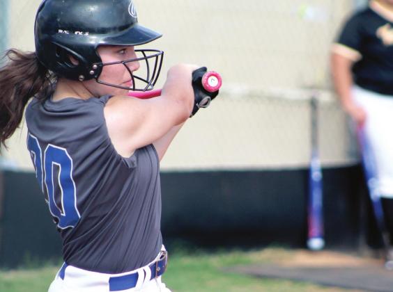 Bethel’s Haylee Wilcox takes her turn at bat in the fourth inning of the Class 5A District slowpitch game on April 21 at Tecumseh.