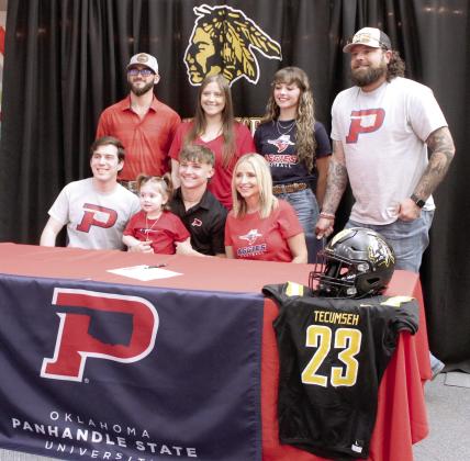 Tecumseh senior Zant Shirey signed a letter of intent for football with Oklahoma Panhandle State University in Goodwell on March 11. Shown, seated from left, are brother Ethan Shirey, Wren Shirey, Shirey, mother Misty Shirey, back row, Garrett Degelos, sister Dacee Degelos, Kyann Sells and Kyle Goodin. Natasha Dunagan, Countywide &amp; Sun