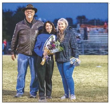 Rick and Cindy Stiles pose with their daughter, Bethel senior, Summer Stiles, who is in the Pride of Bethel Marching Band. Bethel held its Senior Night ceremonies before the home football game on Oct. 28. Photo provided by Richelle Treece.