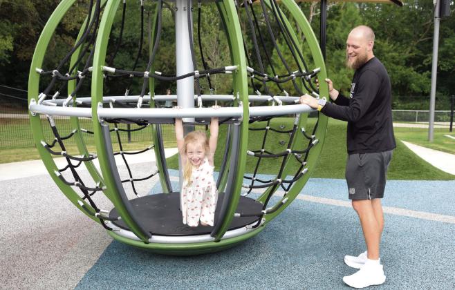 OBU Recruiting Coordinator and Tight-end Coach Zach Blevins plays with his three-year-old daughter, Millie.