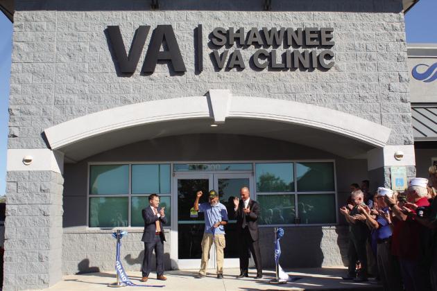 Everyone applauds after Vietnam Navy Veteran Lawfton Edwards cuts the ribbon for the Shawnee VA Clinic during the Grand Opening on Oct. 21. Also shown are OKC VA Healthcare Systems Associate Director Paul Gregory, left, and Director Wade Vlosich, right, as well as several other veterans. Countywide &amp;amp; Sun/Natasha Dunagan