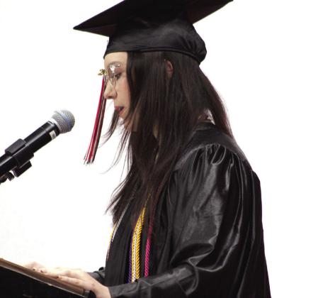Macomb High School Valedictorian Kaylin Musshafen addresses her fellow graduates during commencement. MHS graduated 24 seniors this year. Musshafen spoke about the strengths of her friends and wished everyone luck in their "beginning of a whole new level of opportunity."