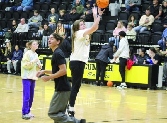 Tecumseh Lady Savage basketball player Reagan Berry shoots in the Gotcha game between Donkey Basketball games, Oct. 29. Berry won the first of two rounds, with Tristain Baney winning the second round.