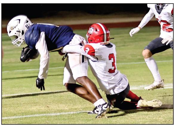 North Rock Creek’s Tyson Hawkins stops the touchdown run. Photo courtesy of Gowin Photography
