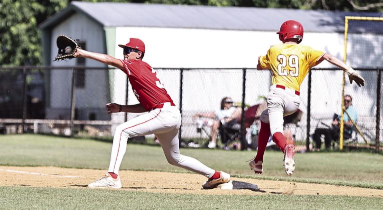 North Rock Creek's Grady Gates stretches for the catch to get the Dale runner out at first. Photo courtesy of Gowin Photography