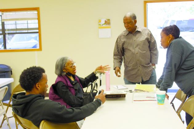 Kaye Napoleon, second from left, talks with her grandson, Anthony O'Guinn, far left, Bobby Jackson, and Bonita Huffman during the Brooksville 120th Year Celebration on Oct. 14. Countywide &amp; Sun/Natasha Dunagan