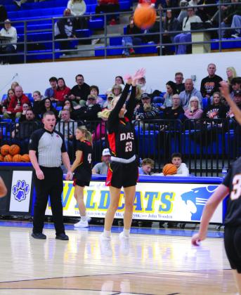 Dale senior Mika Monroe tries for a trey in the fourth quarter of the Lady Wildcats home game on Jan. 20.