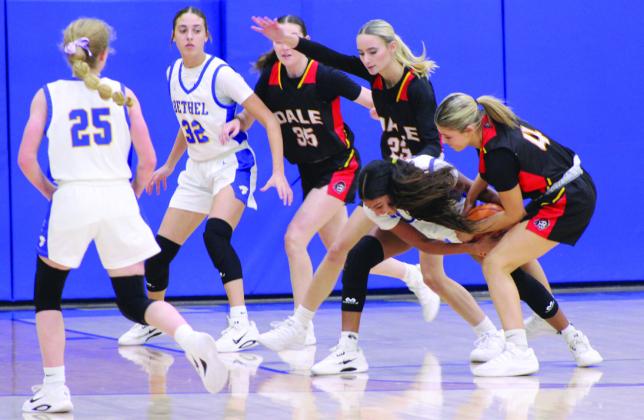 Bethel freshman Kaelynn Mendoza fights with Dale sophomore Breeze Higdon for possession of the ball during the Jan. 20 game at Bethel.