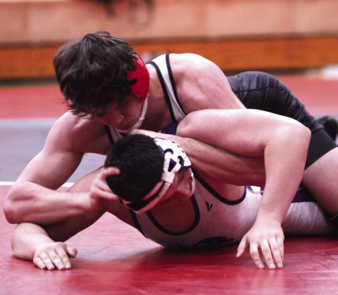 McLoud's Brody Smith, in the 175-weight class, wears down his opponent from Mannford during the McLoud Wrestling Tournament. Photos by Natasha Dunagan, Countywide &amp; Sun