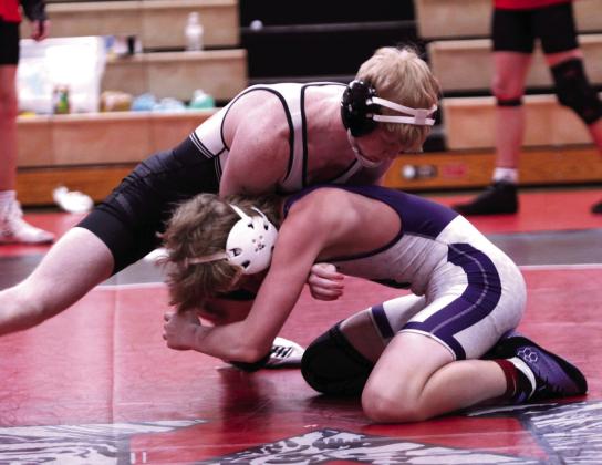 In the 150-weight class, McLoud's Cade Stafford takes down a Mannford athlete.