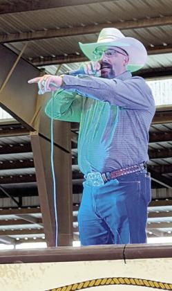 District Attorney Investigator Tony Foreman takes center stage as the auctioneer for the inaugural Shootin' &amp; Scootin' for Justice fundraising event.