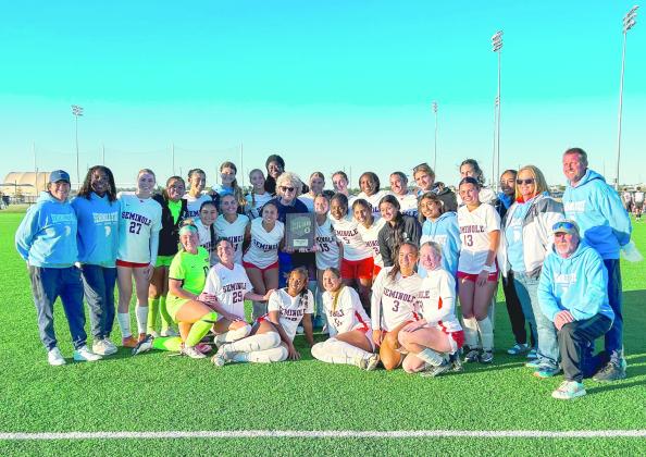 The Seminole State College women’s soccer team poses for a photo after winning the NJCAA Central Plains District Tournament on Saturday, Nov. 1, at the Advance Soccer Complex in Enid. The victory sends the Trojans to the NJCAA Division I Women’s Soccer National Championship tournament. Photo Provided