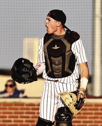 North Rock Creek’s Braden Ueltzen’s pumped with three up, three down in the game against Harrah.