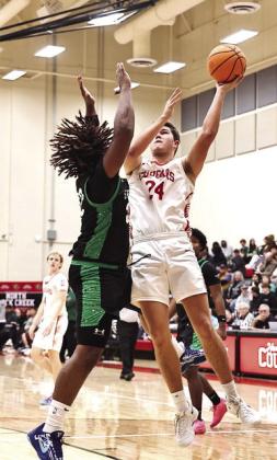 Jace Plumb goes to the basket for two of his 15 points in the home game against Seminole on Dec. 5. Cougars outscored the Chieftains 64-34 for the win. Photo Courtesy of Gowin Photography